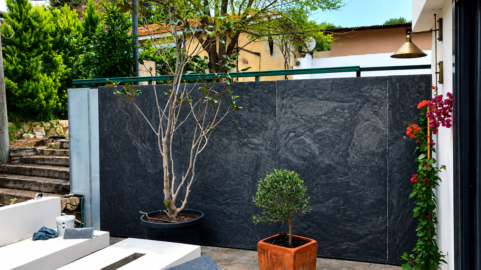 Modern home exterior featuring Skinrock West natural stone cladding with striking natural veining and a durable architectural finish.