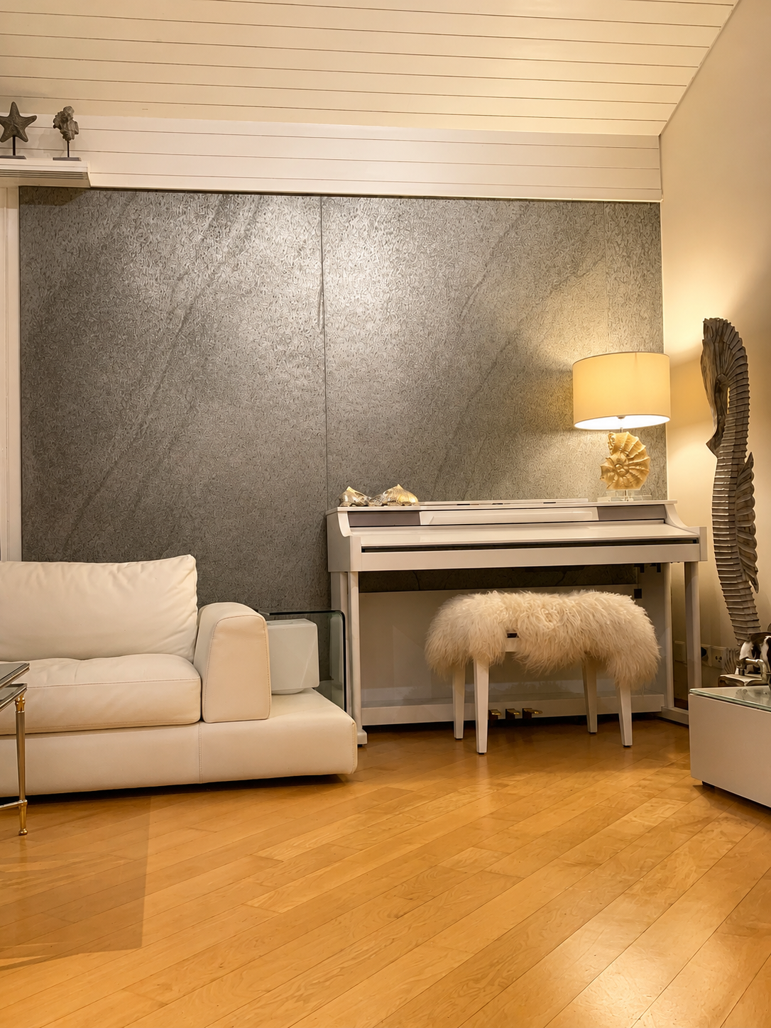 Modern living room featuring a Skinrock West natural stone accent wall that adds warmth, texture, and a contemporary architectural finish.